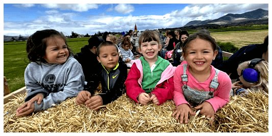 Kids in hay wagon